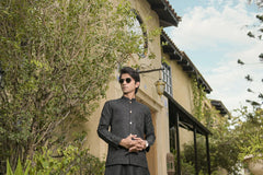 Black waistcoad and black shalwar kameez